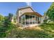 Exterior view of sunroom, showing great natural light, and adjacent yard space at 4825 Samuel Richard St, Kannapolis, NC 28083