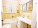 Classic bathroom with yellow tile, white fixtures, and vintage charm at 495&501 Turnersburg Hwy, Statesville, NC 28625