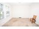 Bright bedroom with neutral carpet, natural light from a window, and a simple chair at 495&501 Turnersburg Hwy, Statesville, NC 28625