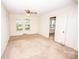 Bright, spacious bedroom with neutral carpet, ample natural light, and two closets at 495&501 Turnersburg Hwy, Statesville, NC 28625