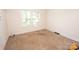 Bright bedroom with neutral carpet and natural light from a window at 495&501 Turnersburg Hwy, Statesville, NC 28625