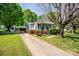 Well-maintained home with a detached garage and colorful landscaping along the driveway at 495&501 Turnersburg Hwy, Statesville, NC 28625