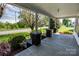 Inviting front porch with classic columns offering a view of the surrounding yard and neighborhood street at 495&501 Turnersburg Hwy, Statesville, NC 28625