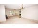 Bright living room with carpet, a wood burning stove, and ample natural light at 495&501 Turnersburg Hwy, Statesville, NC 28625
