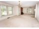 Large living room featuring a fireplace and multiple windows for natural light at 495&501 Turnersburg Hwy, Statesville, NC 28625