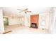 Bright living room featuring a brick fireplace and a ceiling fan at 495&501 Turnersburg Hwy, Statesville, NC 28625