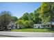Charming street view of homes with lush lawns and mature trees on a sunny day at 495&501 Turnersburg Hwy, Statesville, NC 28625