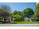 Scenic street with charming houses, green lawns, and mature trees in a vibrant setting at 495&501 Turnersburg Hwy, Statesville, NC 28625