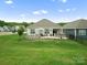 Spacious backyard with patio, stone accents, perfect for outdoor living and entertaining at 5058 Antebellum Dr, Iron Station, NC 28080