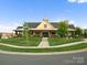 Community clubhouse with manicured lawn and Secretariat Dr street sign at 5058 Antebellum Dr, Iron Station, NC 28080