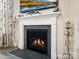 Contemporary fireplace with a sleek design, decorative mantle, and gas logs at 5058 Antebellum Dr, Iron Station, NC 28080