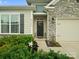 Charming single-Gathering home with stone accents, a cozy front door and two-car garage at 5058 Antebellum Dr, Iron Station, NC 28080