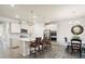 Open concept kitchen with a large island, pendant lighting, stainless steel appliances, and breakfast bar seating at 5058 Antebellum Dr, Iron Station, NC 28080