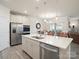 Bright kitchen features stainless appliances, and large island with sink and dishwasher, and overlooks breakfast area at 5058 Antebellum Dr, Iron Station, NC 28080