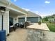 Inviting outdoor patio area with grill and seating under covered patio and a heat lamp at 5058 Antebellum Dr, Iron Station, NC 28080