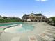 A large community pool and clubhouse on a sunny day, great for families at 5058 Antebellum Dr, Iron Station, NC 28080