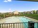 A beautiful community pool featuring lounge chairs and an outdoor kitchen area at 5058 Antebellum Dr, Iron Station, NC 28080
