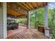 Back porch with view of surrounding woods at 5210 Valley Stream Rd, Charlotte, NC 28209