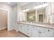 Spacious bathroom featuring double vanity with granite countertops and walk-in shower at 5210 Valley Stream Rd, Charlotte, NC 28209