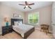 Cozy bedroom with natural light from a large window at 5210 Valley Stream Rd, Charlotte, NC 28209
