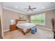 Serene bedroom with a large window, neutral tones, and a comfortable bed at 5210 Valley Stream Rd, Charlotte, NC 28209