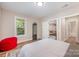Comfortable bedroom with view to sitting area, bathroom, and view to outdoors at 5210 Valley Stream Rd, Charlotte, NC 28209