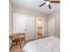Neutral bedroom with a chair and a view to the bathroom with granite countertops at 5210 Valley Stream Rd, Charlotte, NC 28209