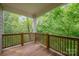 Relaxing back deck overlooking lush greenery and trees at 5210 Valley Stream Rd, Charlotte, NC 28209