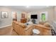 Inviting living space with comfortable couches, television, and easy access to outdoor spaces at 5210 Valley Stream Rd, Charlotte, NC 28209