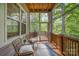 Relaxing screened porch with comfortable seating and a view of the lush greenery at 5210 Valley Stream Rd, Charlotte, NC 28209