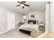 The bedroom has a ceiling fan and generous natural light at 5257 Glenlea Walk Ln, Charlotte, NC 28216