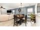 Cozy dining area featuring stylish wainscoting and a modern light fixture at 5257 Glenlea Walk Ln, Charlotte, NC 28216