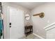 Bright entryway with wood-look flooring, decorative mirror and coat rack at 5257 Glenlea Walk Ln, Charlotte, NC 28216