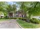 Charming townhouse with brick accents, well-manicured landscaping, and a welcoming entrance, radiating curb appeal at 5257 Glenlea Walk Ln, Charlotte, NC 28216