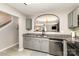 View of open concept kitchen with gray cabinets, granite countertops and a stainless steel dishwasher at 5257 Glenlea Walk Ln, Charlotte, NC 28216