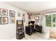Functional home office with desk, computer, and natural light from sliding glass doors at 5257 Glenlea Walk Ln, Charlotte, NC 28216
