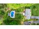 Aerial view of the home showcasing the pool, landscaping, and large backyard at 5486 Suttlemyre Ln, Hickory, NC 28601