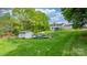 Expansive backyard with a pool, shed, and lush greenery at 5486 Suttlemyre Ln, Hickory, NC 28601