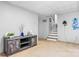 Spacious finished basement with a decorative cabinet, staircase, and neutral-colored carpeting at 5486 Suttlemyre Ln, Hickory, NC 28601