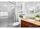 Updated bathroom with a glass enclosed shower, granite countertop, and a dark wood vanity at 5486 Suttlemyre Ln, Hickory, NC 28601