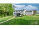 Two-story home featuring a screened-in porch and a landscaped yard at 5486 Suttlemyre Ln, Hickory, NC 28601