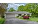Single-story home featuring a brick exterior, green lawn, and mature trees adding curb appeal at 5486 Suttlemyre Ln, Hickory, NC 28601