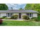 Inviting front entrance with a well-manicured lawn and shrubbery at 5486 Suttlemyre Ln, Hickory, NC 28601