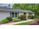 Charming front entrance with a well-manicured lawn and shrubbery at 5486 Suttlemyre Ln, Hickory, NC 28601