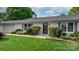 Charming front entrance with a well-manicured lawn and shrubbery at 5486 Suttlemyre Ln, Hickory, NC 28601