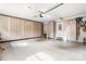 Well-organized garage with built-in storage cabinets and epoxy flooring, offering ample space for vehicles and tools at 5486 Suttlemyre Ln, Hickory, NC 28601