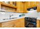 Close-up of kitchen featuring wood cabinets, white countertops, and subway tile backsplash at 5486 Suttlemyre Ln, Hickory, NC 28601