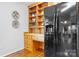Kitchen with a built-in desk area and black appliances at 5486 Suttlemyre Ln, Hickory, NC 28601