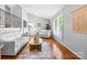 Bright living room with vaulted ceilings, hardwood floors, and large windows at 5486 Suttlemyre Ln, Hickory, NC 28601