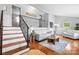 Spacious living room with hardwood floors and a staircase leading to the upper level at 5486 Suttlemyre Ln, Hickory, NC 28601